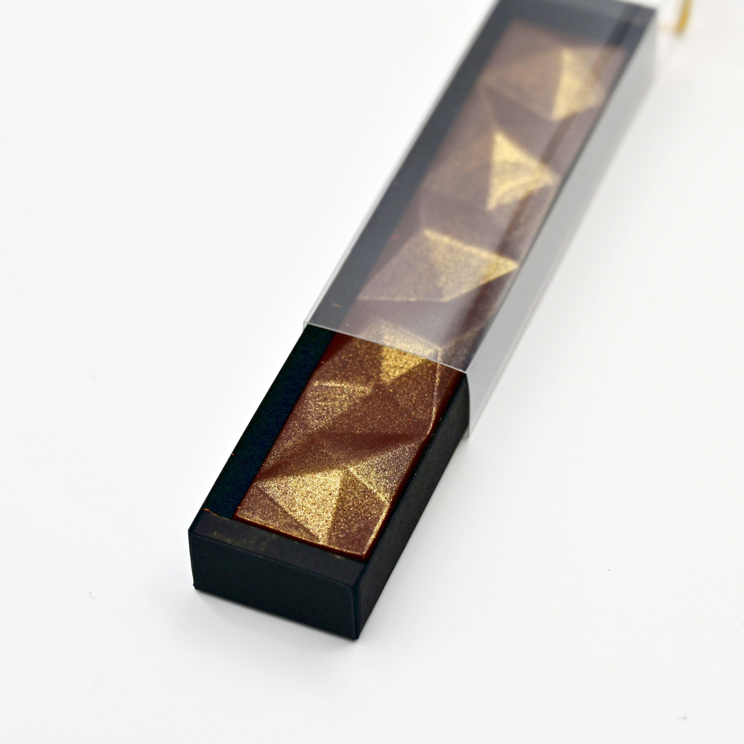 Riegel «Diamant», Dunkle Schokolade (32g) | Chani Schoggi Dunkle Schokolade «Nicaragua 66%» in Riegelform mit goldenem Glanzpuder.